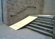 Makeshift Ramp - a piece of wood sitting on steps