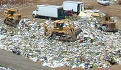 Diggers at a landfill site