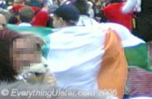 Another spectator carrying a larger Irish tricolour
