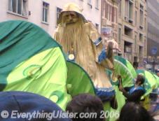 Giant puppet of Saint Patrick riding a snake