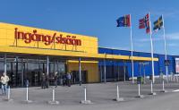 Entrance to IKEA store, Haparanda, Sweden (with bilingual Swedish/Finnish signage). The leftmost flag is the Sami flag.